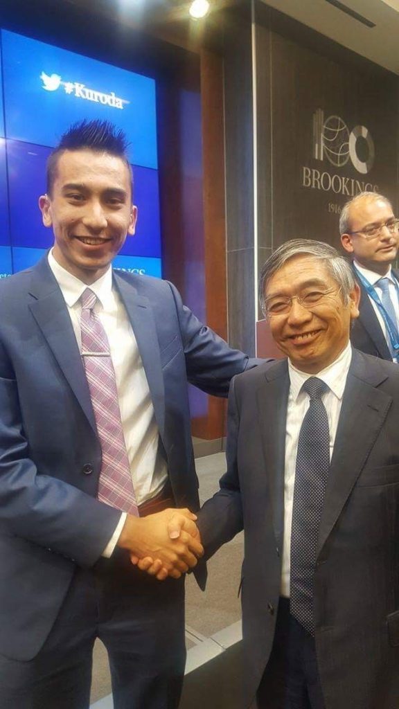 Khojinur Usmonov with Bank of Japan Governor Haruhiko Kuroda